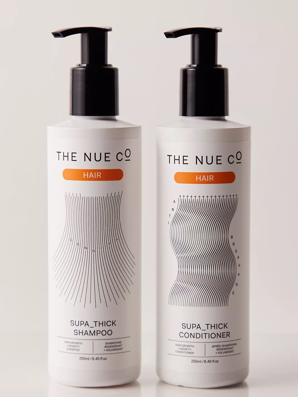 The Nue Co Supa_Thick Hair Shampoo & Conditioner Set - White with Orange Accent